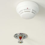 Sprinkler and smoke detector on the ceiling
